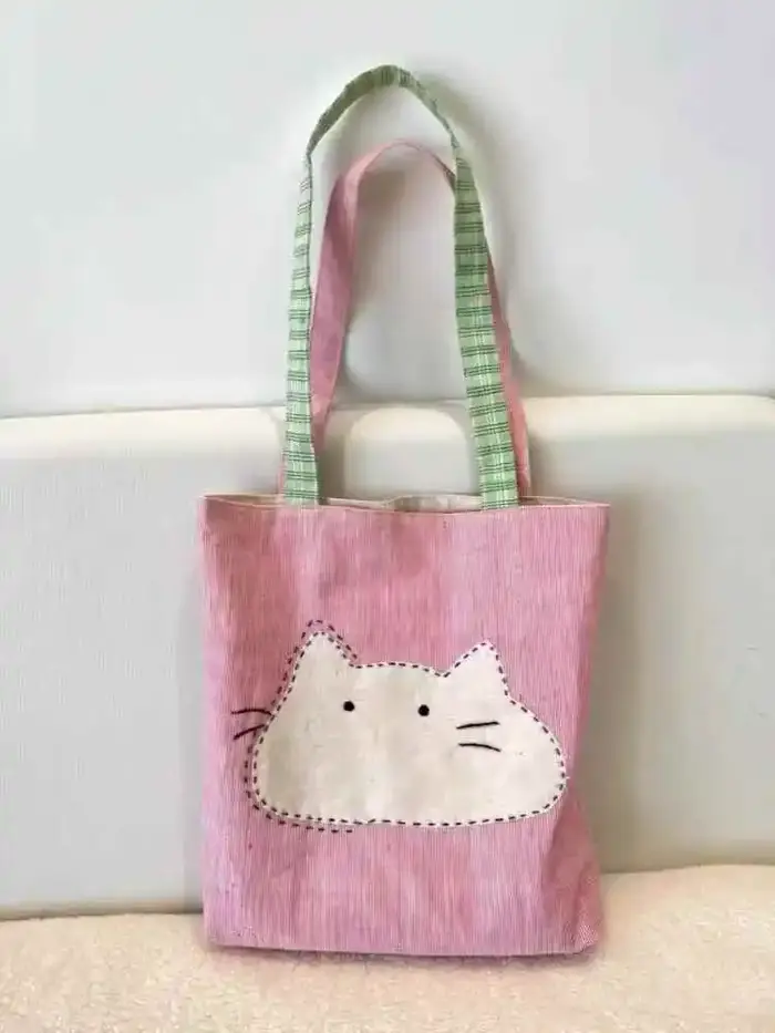 2025 nouveau sac en tissu à bandoulière unique japonais polyvalent et simple sac en toile pour femmes sac de transport artistique chat de dessin animé mignon