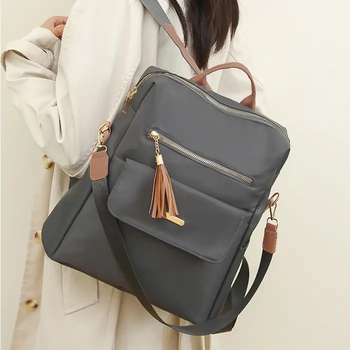 Sac à dos de style neutre pour hommes et femmes, adapté aux voyages, au tourisme, à la photographie et aux étudiants comme cartable.