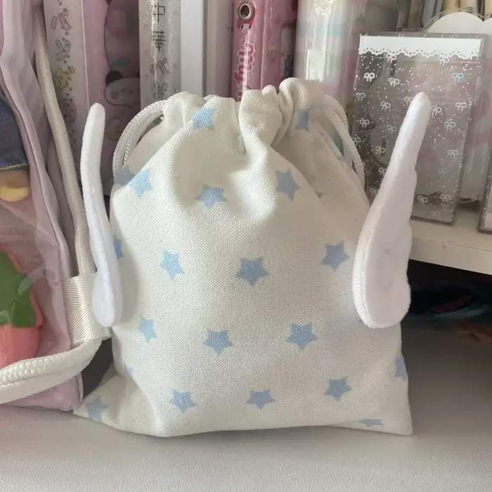 Sac de rangement portable tendance en toile anti-poussière avec motif étoile et cordon de serrage pour cosmétiques et papeterie