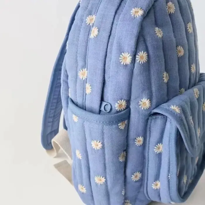 Sac à dos d'étudiant bleu marguerite de dessin animé, sac d'école brodé mignon, sac à dos décontracté unisexe tendance pour les voyages en plein air