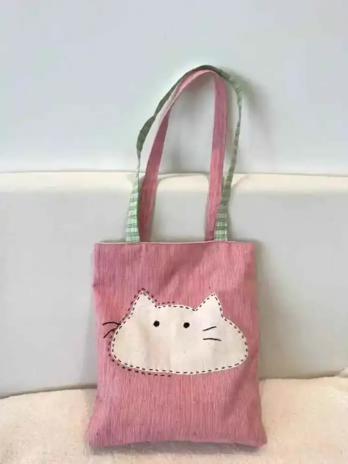 2025 nouveau sac en tissu à bandoulière unique japonais polyvalent et simple sac en toile pour femmes sac de transport artistique chat de dessin animé mignon