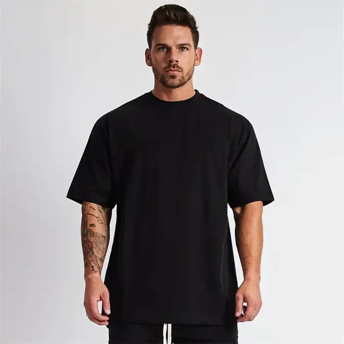 Couleur unie Gym course Sport vêtements Fitness surdimensionné chemise en coton ample hommes Hip Hop à manches courtes musculation Muscle T-shirt