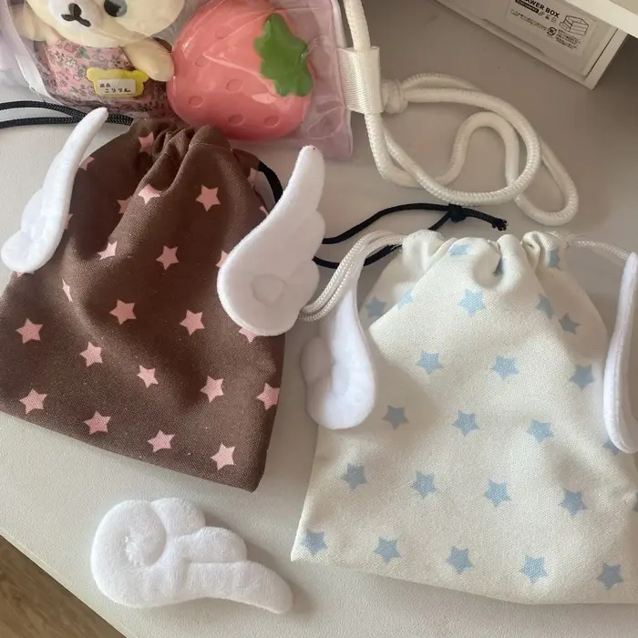 Sac de rangement portable tendance en toile anti-poussière avec motif étoile et cordon de serrage pour cosmétiques et papeterie